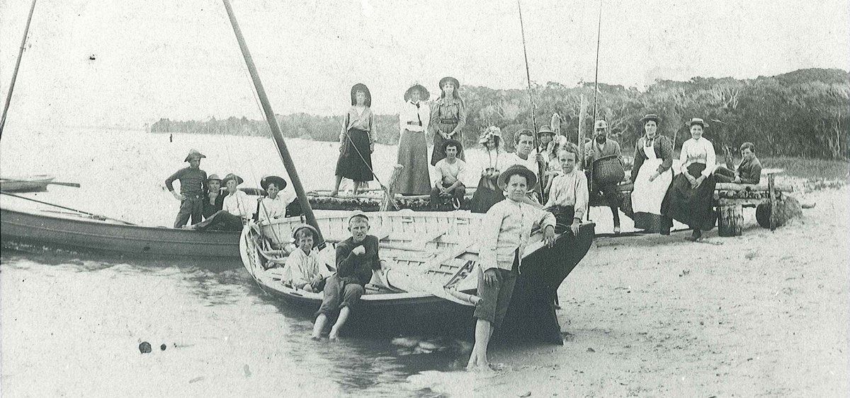 Headmaster R.H. Roe and his wife, Maud (back row 4th and 3rd from right) with a boating party near Kamp Roe, circa 1890.